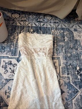Lacy white tie up dress with nude boning